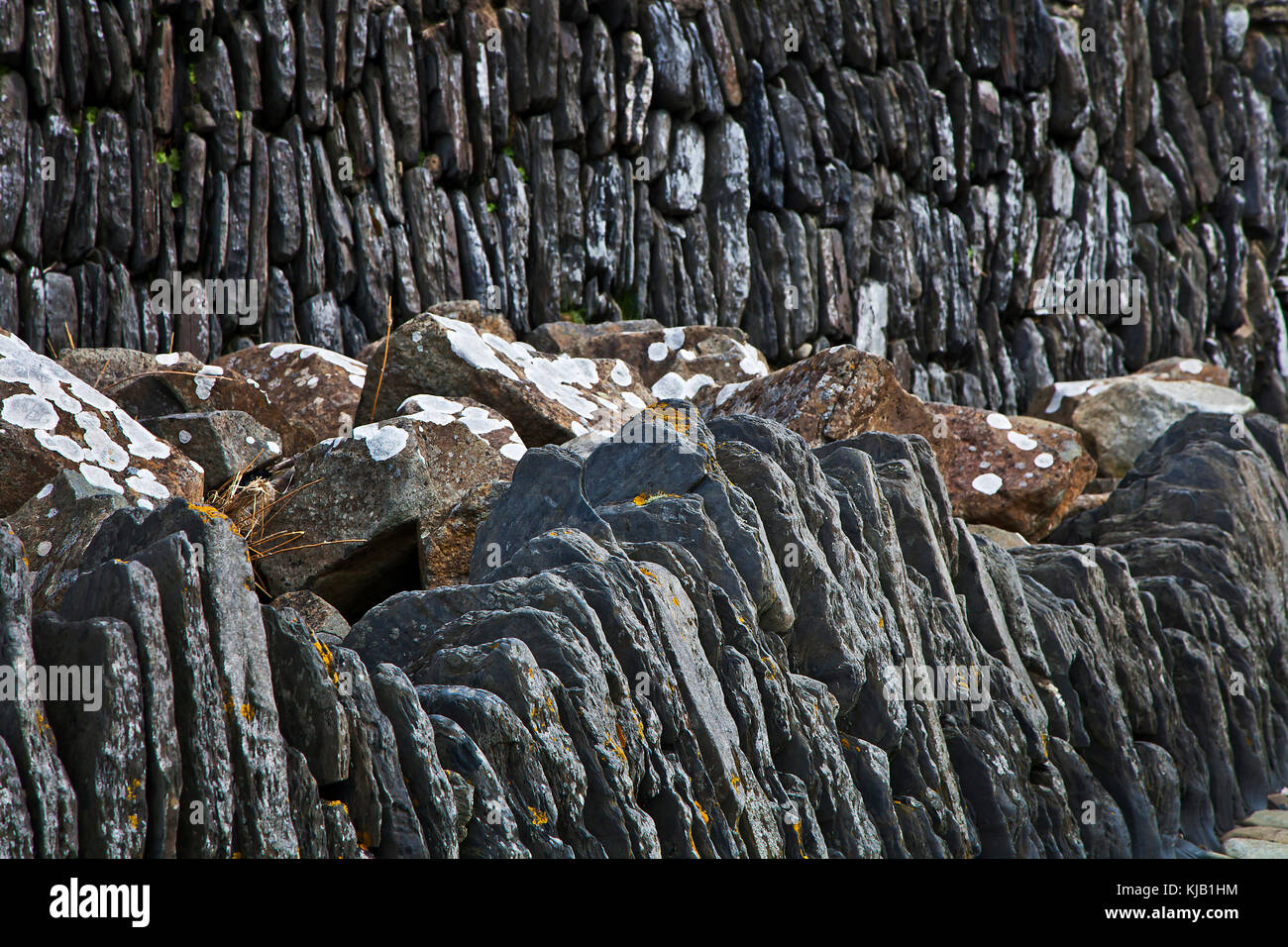 Old sea wall rough stone work Stock Photo