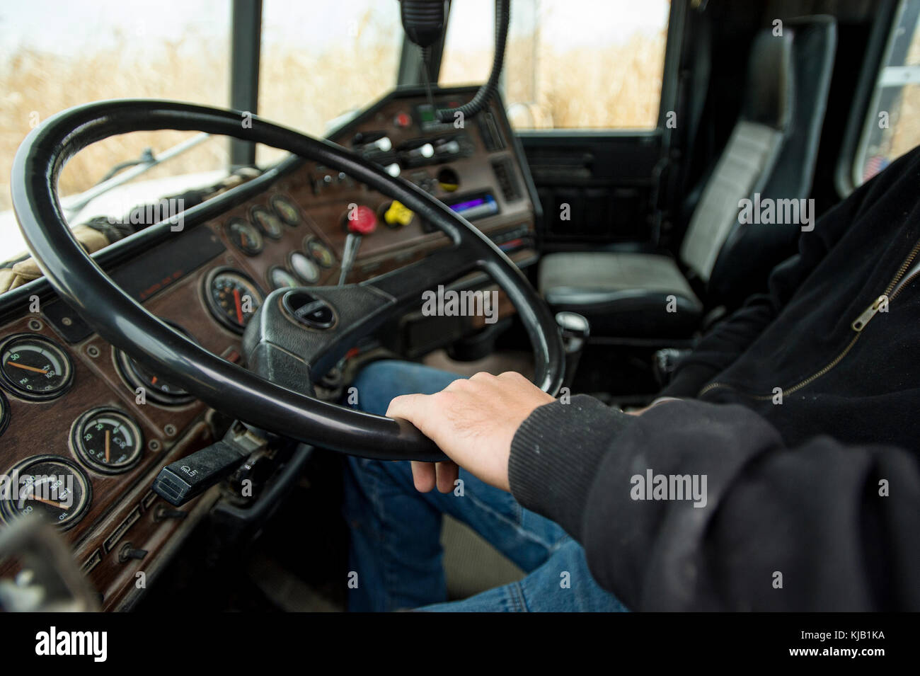 INSIDE VIEW OF TRUCK CAB AND STEERING WHEEL, BLOOMING PRAIRIE, MINNESOTA. Stock Photo
