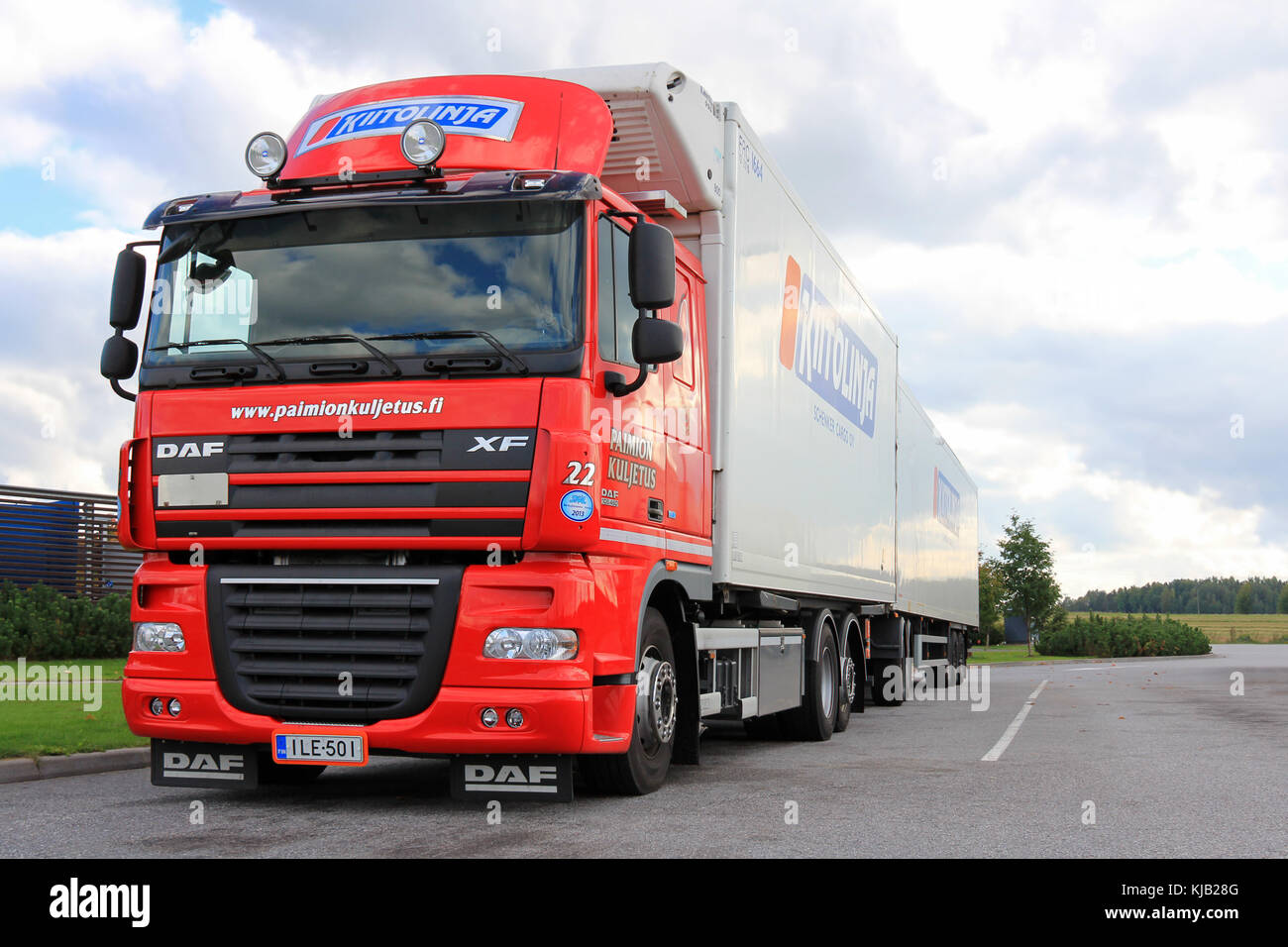 TURKU, FINLAND - SEPTEMBER 15, 2013: Red DAF XF105 truck with temperature controlled trailer parked. At the start of 2015, DAF introduces a large numb Stock Photo