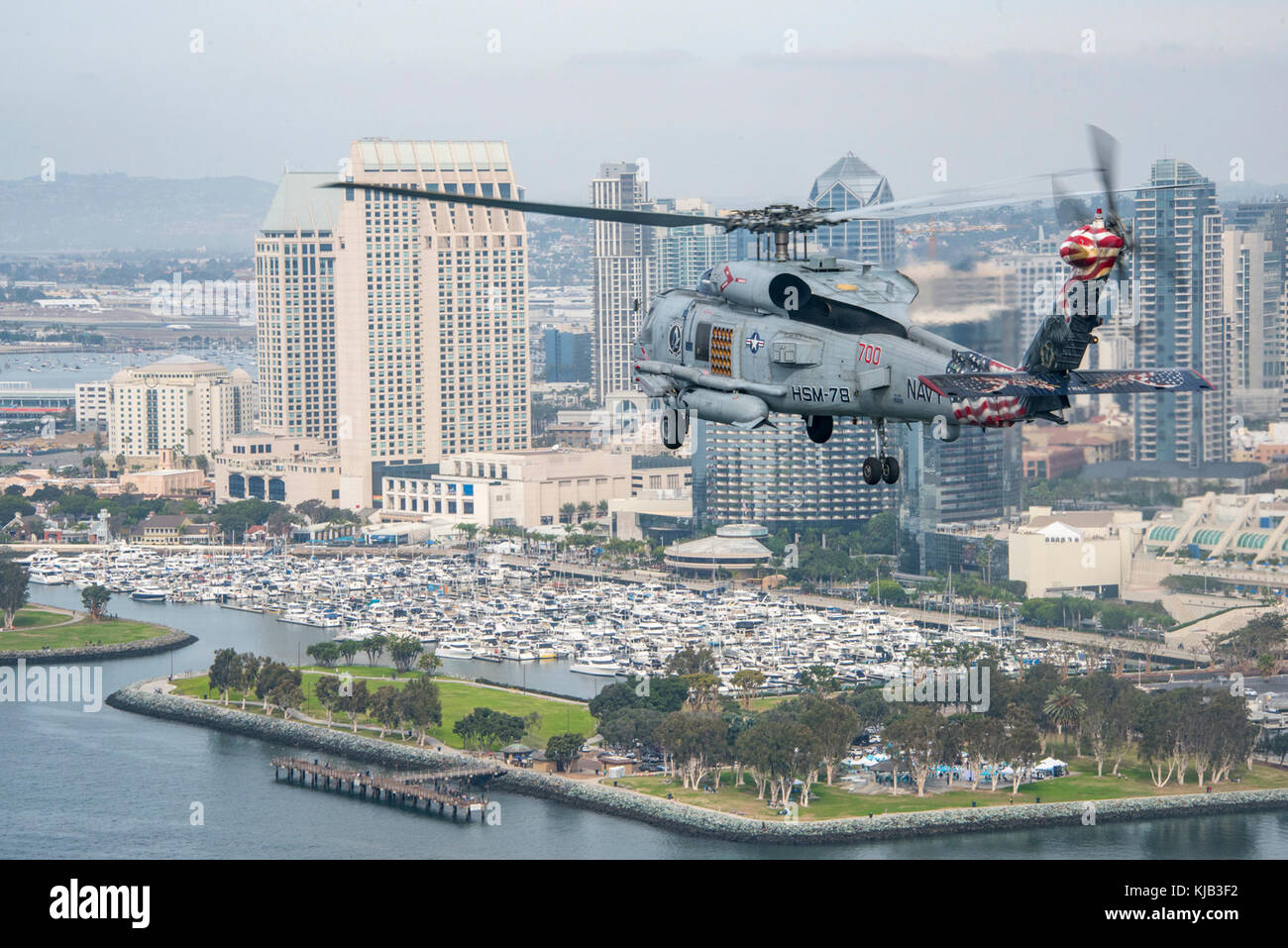 171112-N-BL637-0128  SAN DIEGO (Nov. 12, 2017) An MH-60R Sea Hawk helicopter assigned to the “Blue Hawks” of Helicopter Maritime Strike Squadron (HSM) 78 conducts training near the Nimitz-class aircraft carrier USS Carl Vinson (CVN 70). Members of Carrier Strike Group (CSG) 1 are participating in a sustainment training exercise in preparation for an upcoming deployment. (U.S. Navy photo by Mass Communication Specialist 2nd Class Sean M. Castellano/Released) Stock Photo