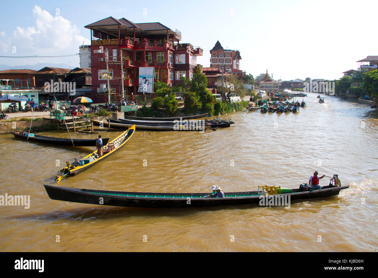 People ride boats near Inle Lake in Nyaungshwe, Myanmar. Inle lake is a ...
