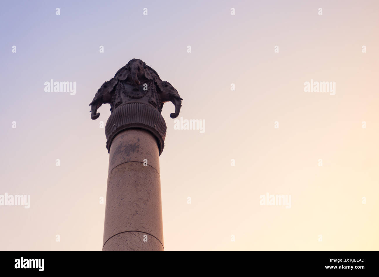 four elephants facing in each direction on a pillar Stock Photo Alamy
