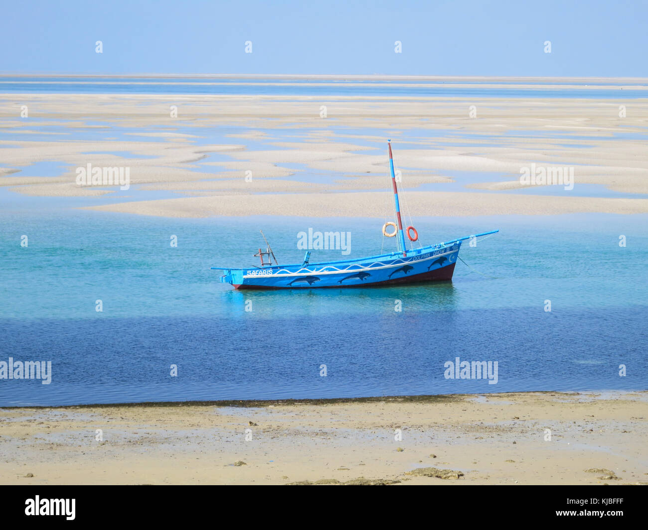 Dhow on the shores of Vilankulo, Mozambique at low tide. Stock Photo