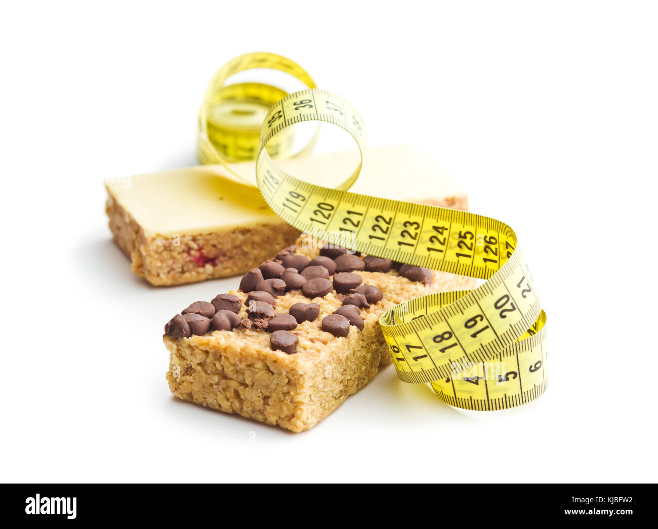 Oat protein bar and measuring tape isolated on white background. Diet concept. Stock Photo