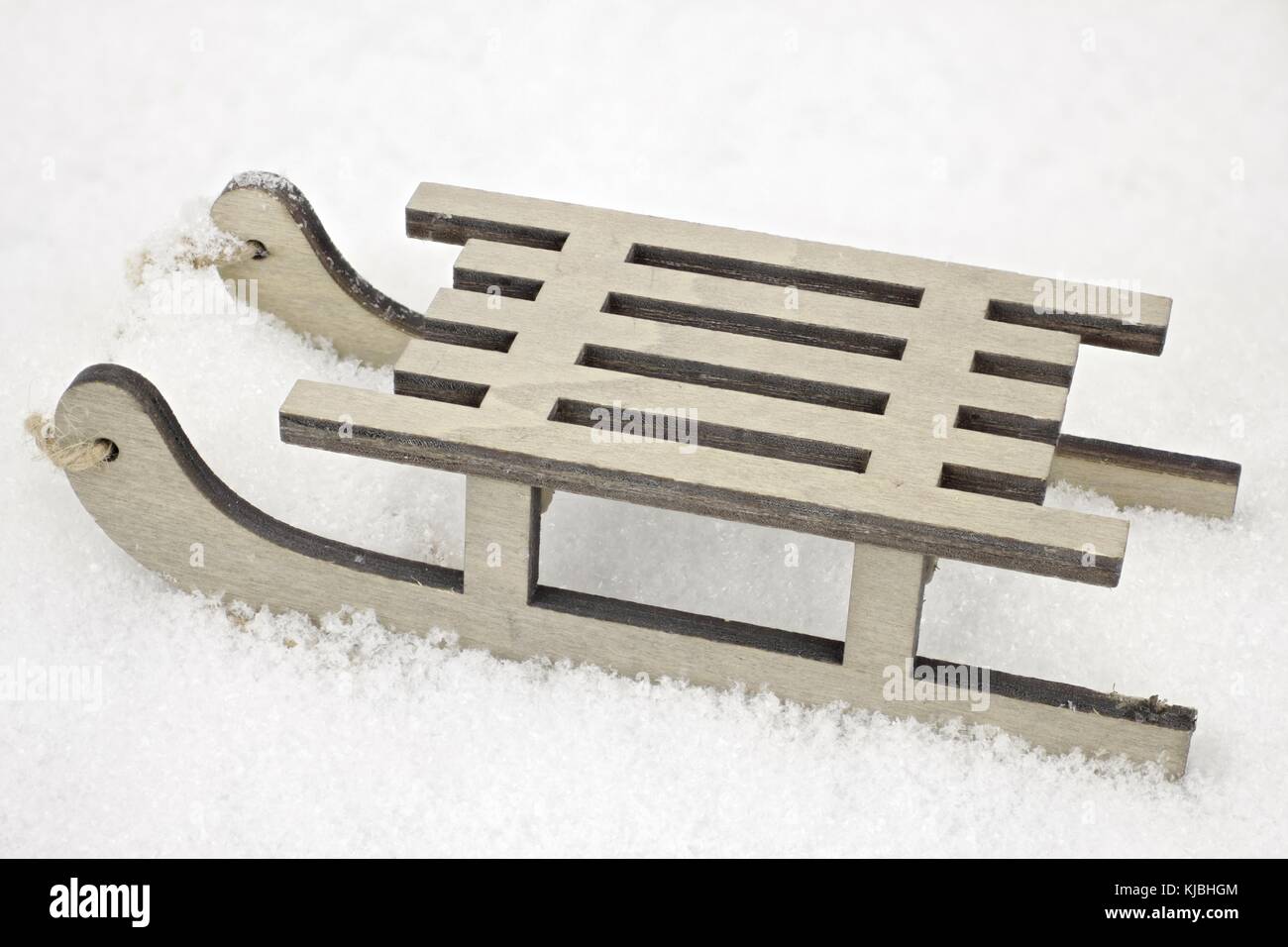 A small wooden sled in closeup as a decorative background Stock Photo