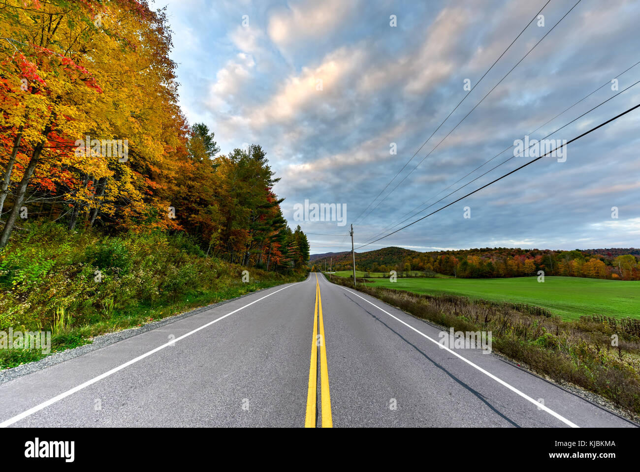 Peak fall foliage in Vermont against a dramatic sky Stock Photo Alamy