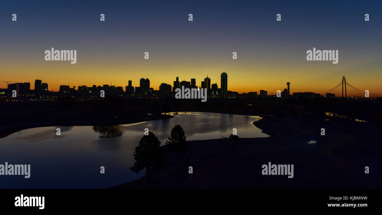 Downtown Dallas skyline at sunrise in Texas, USA from the Trinity River