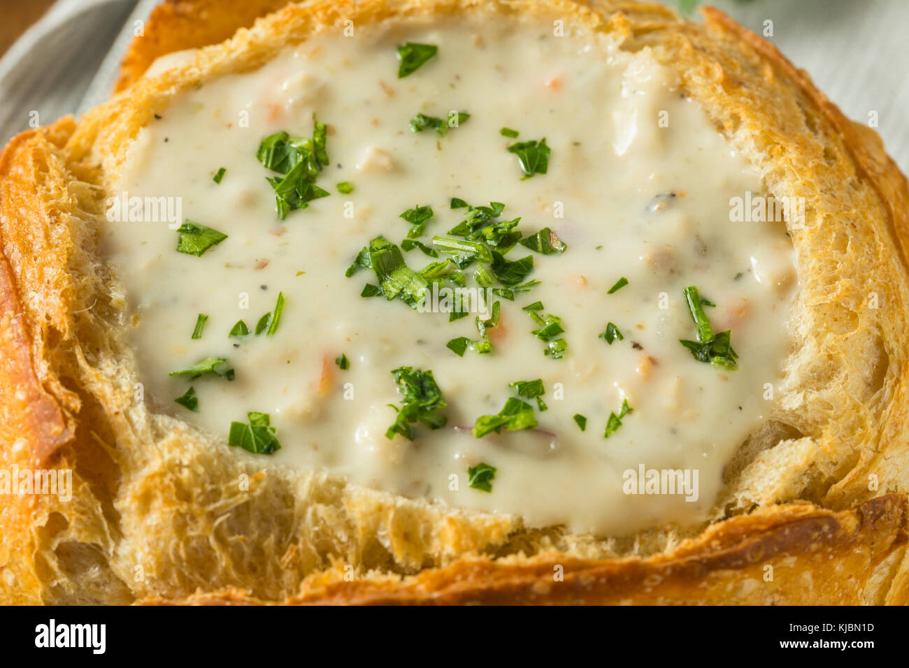 New England Clam Chowder in a Bread Bowl with Parsley Stock Photo Alamy