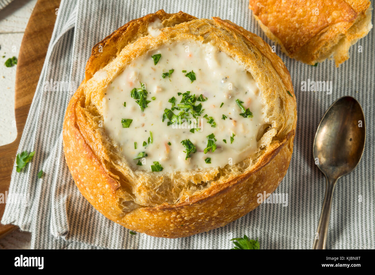New England Clam Chowder in a Bread Bowl with Parsley Stock Photo Alamy