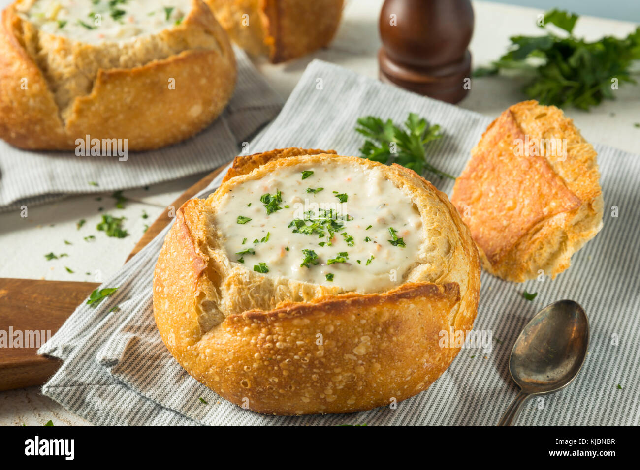 New England Clam Chowder in a Bread Bowl with Parsley Stock Photo Alamy