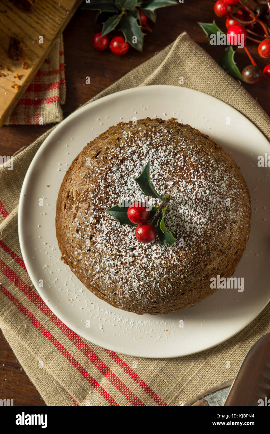 Sweet Homemade Christmas Figgy Pudding with Powdered Sugar Stock Photo