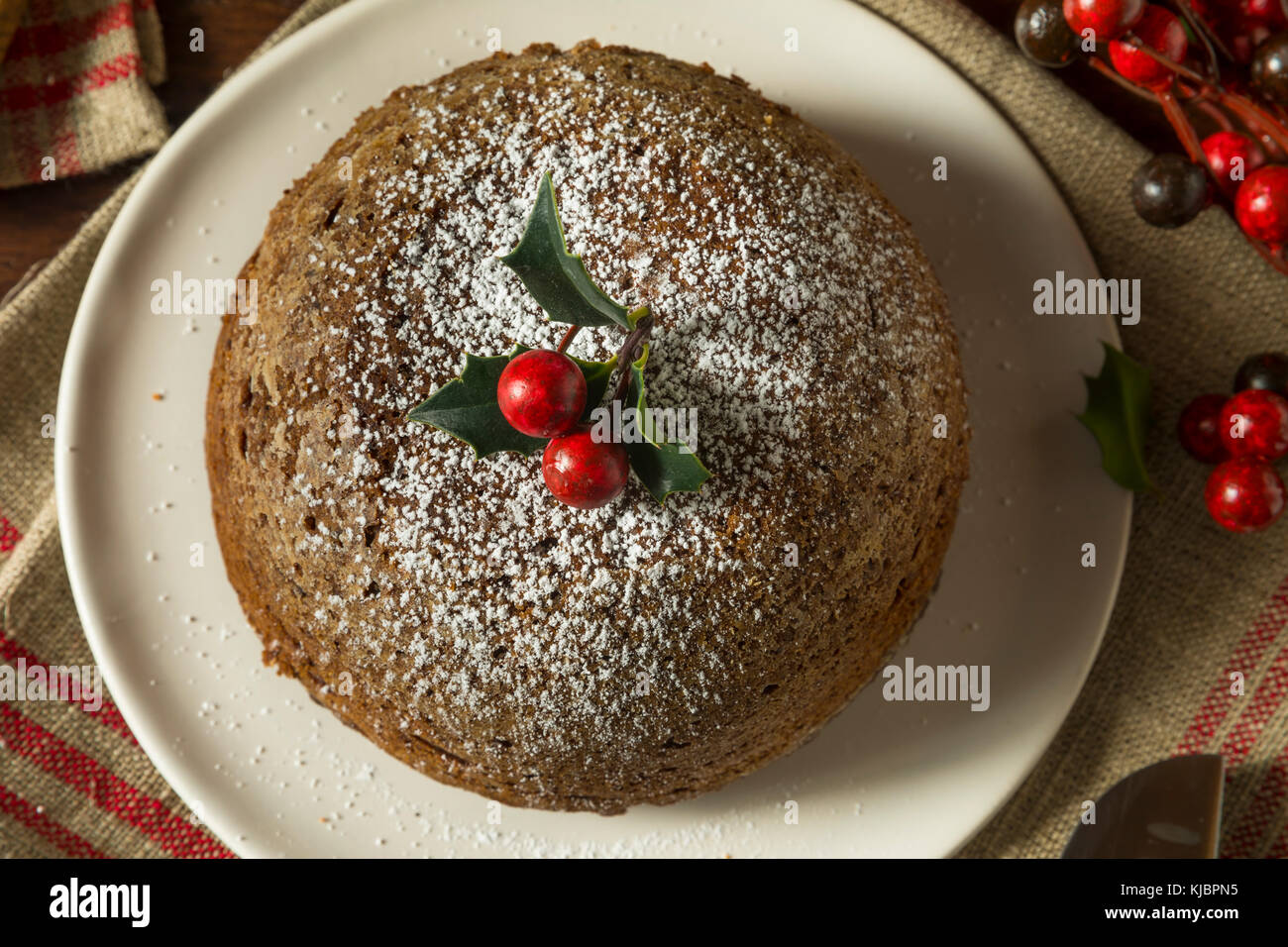 Sweet Homemade Christmas Figgy Pudding with Powdered Sugar Stock Photo