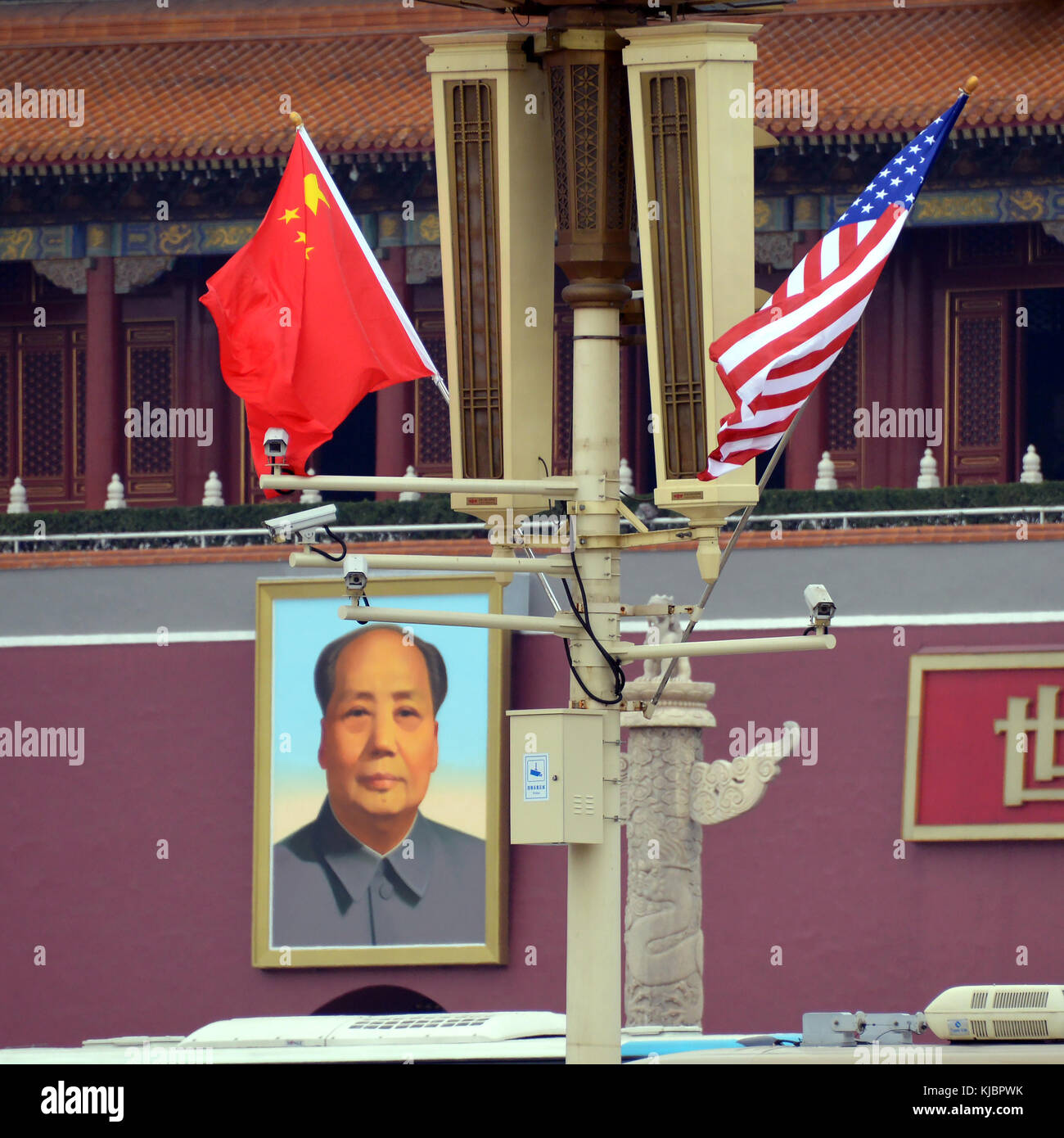 Beijing, China - November 9, 2017:  US and Chinese flags are on display outside the Forbidden City area for the State Visit Plus of President Donald Trump. Stock Photo