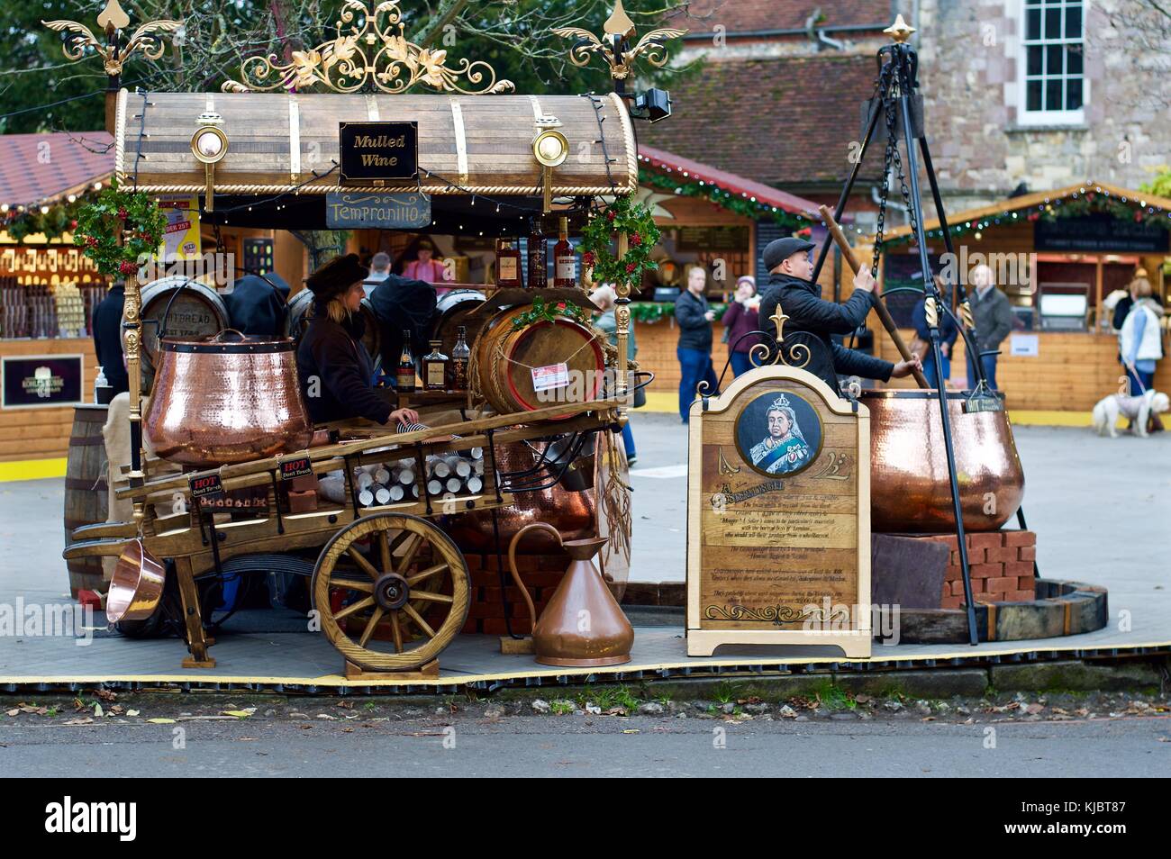 Vendors selling mulled wine at Winchester Christmas Market 2017 outside Winchester Cathedral, Winchester UK Stock Photo