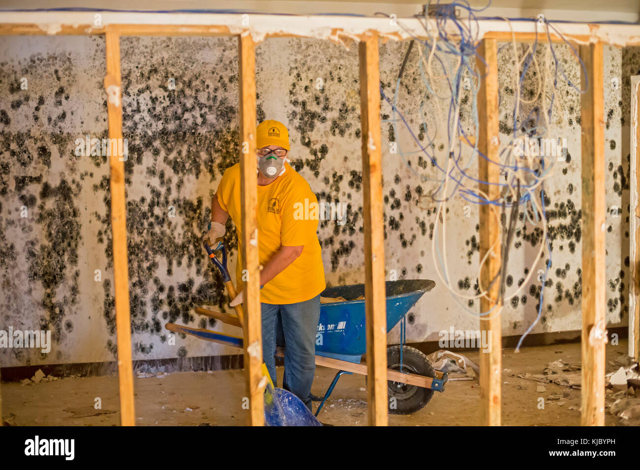 Humble, Texas - Oklahoma volunteers from the Southern Baptist Convention clean debris from the Mana Family Worship Center, which was flooded when Hurr Stock Photo