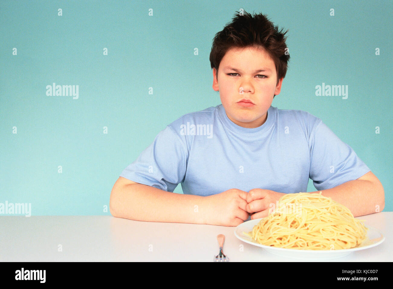 Boy with Plate of Spaghetti Stock Photo