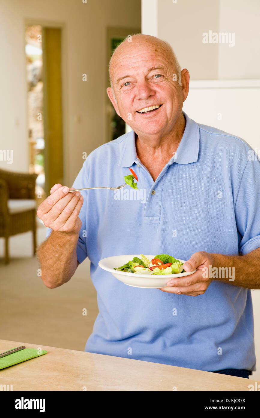 Portrait of Man Eating Salad Stock Photo Alamy