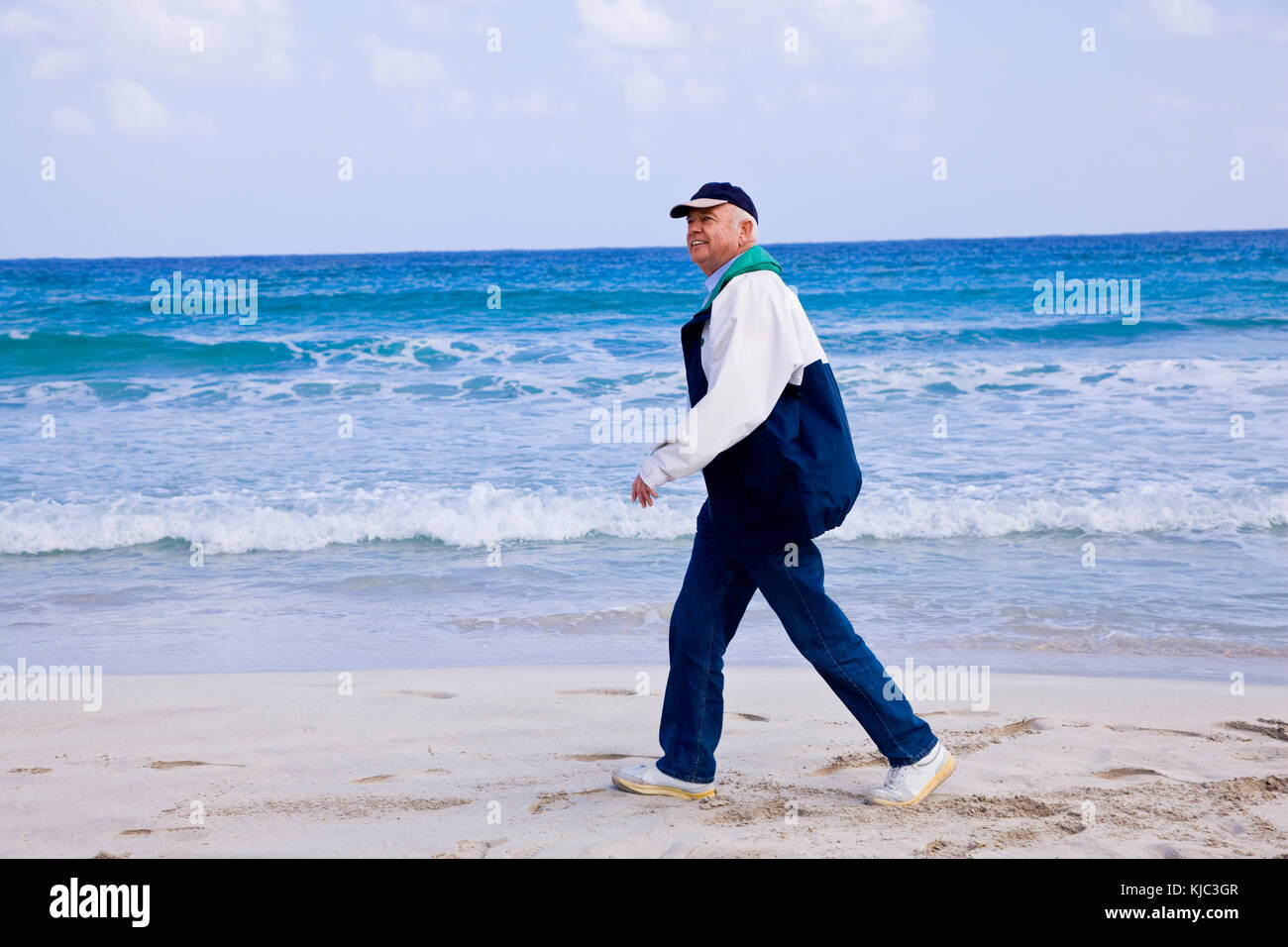 Man Walking on the Beach Stock Photo - Alamy