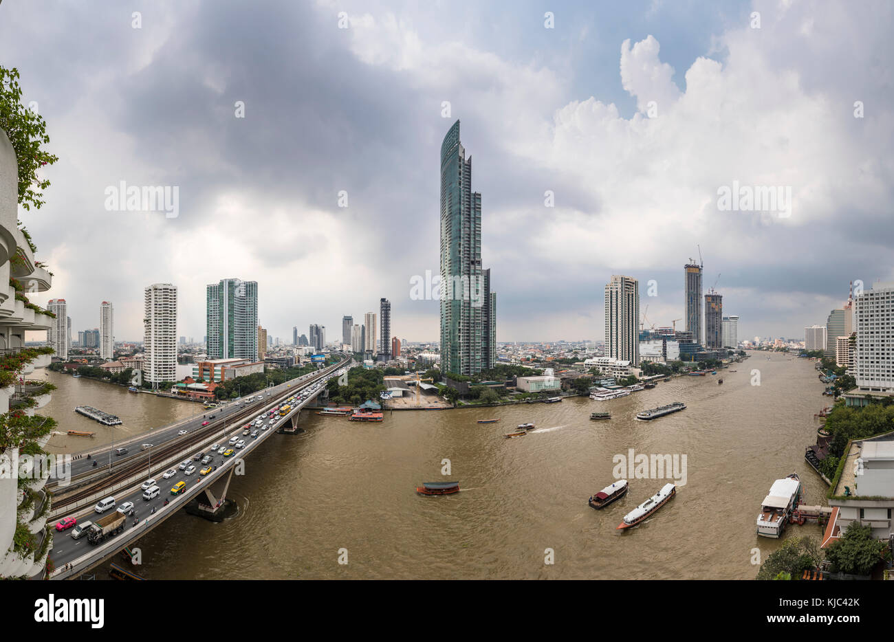 Krung Thon Buri Road, King Taksin Bridge over the Chao Phraya River, iconic skyscrapers from the west bank Khlong San district, Bangkok, Thailand Stock Photo