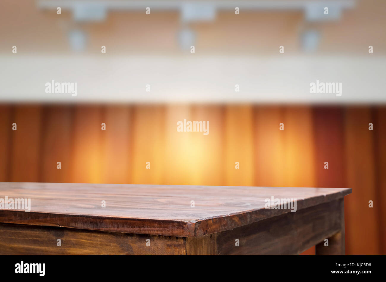 Empty wood table and blurred booked cafe light background. product ...