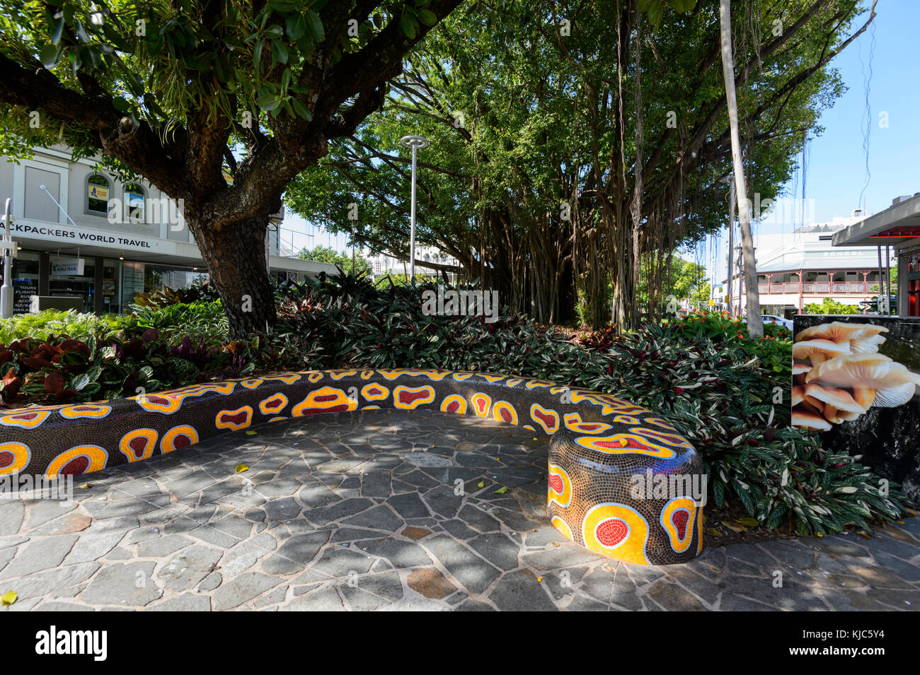 Mosaic Aboriginal artwork on a bench shaped as a snake in Shields Street, Cairns, Far North Queensland, FNQ, QLD, Australia Stock Photo