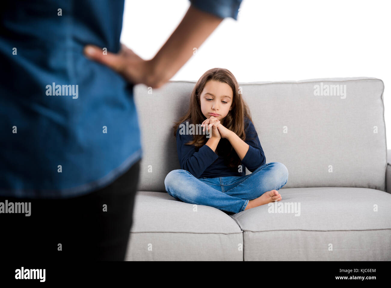 Grown up rebuking a little child for bad behavior Stock Photo