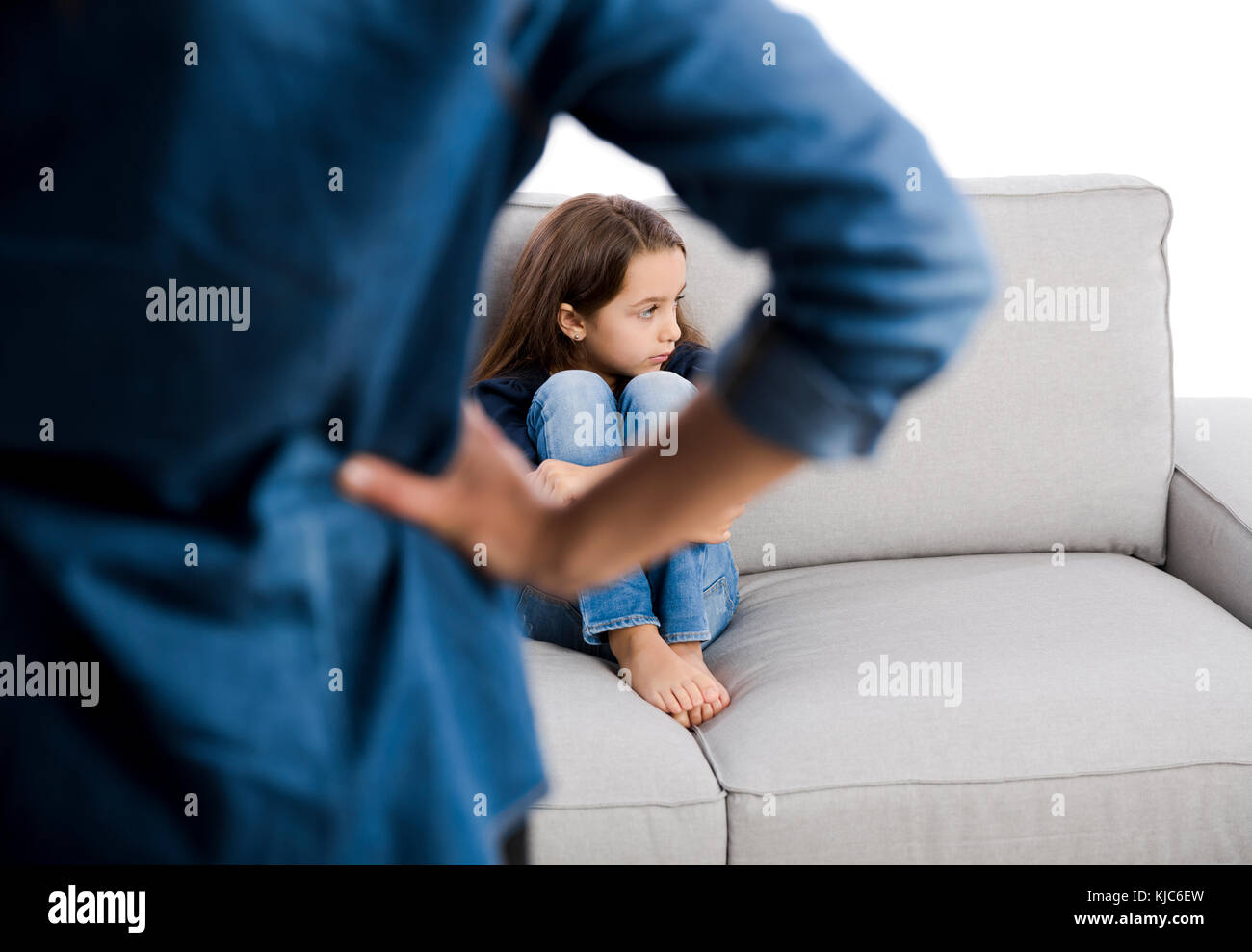 Grown up rebuking a little child for bad behavior Stock Photo