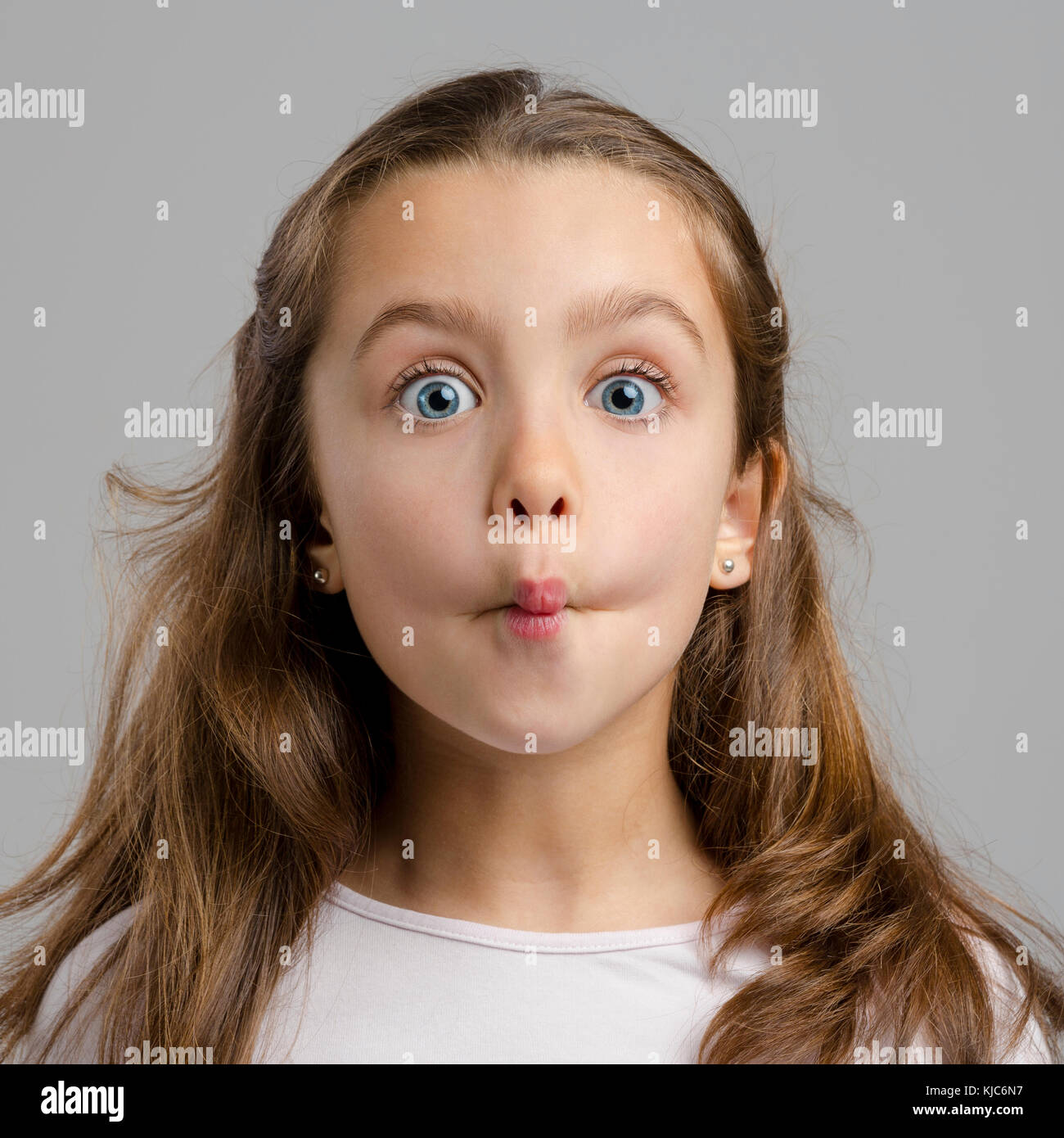 Portrait of a little girl with a funny expression Stock Photo