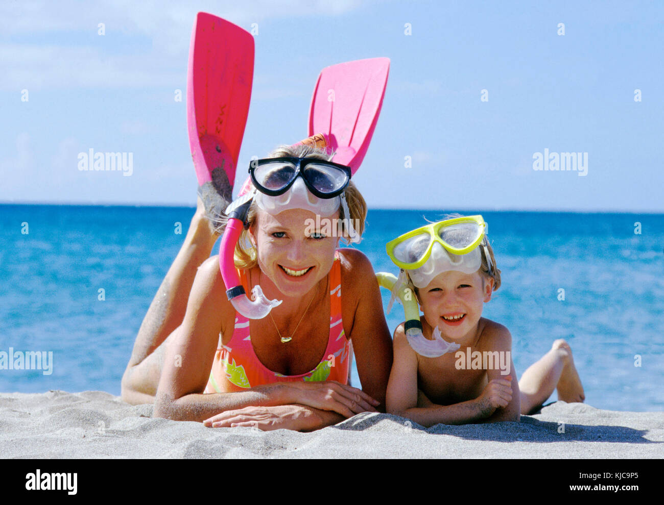 Mum and child taking a break from snorkling Stock Photo