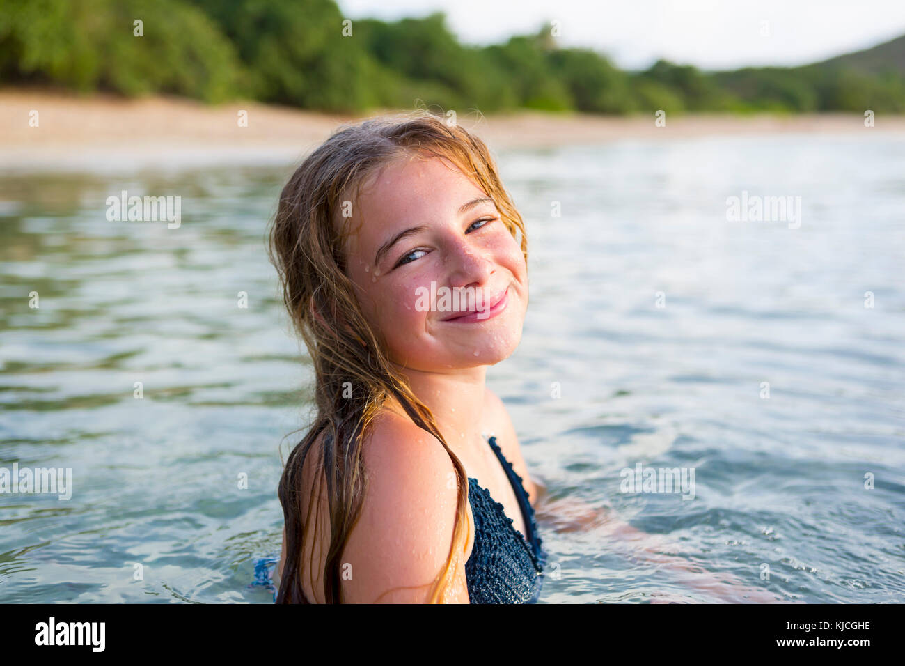 Portrait of smiling Caucasian girl swimming Stock Photo