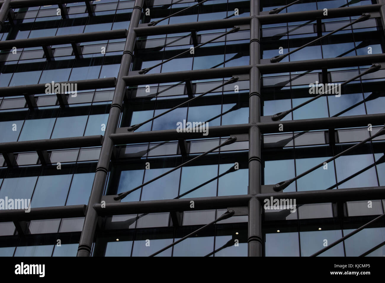 A shot of the facade of the Cannon place in the City of London. It has great architecture focus on design and structure due to the metro station under Stock Photo