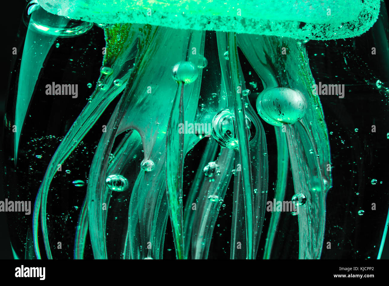 Macro photograph of a glass sculpture. Glass sculpture resembling a jellyfish. Stock Photo