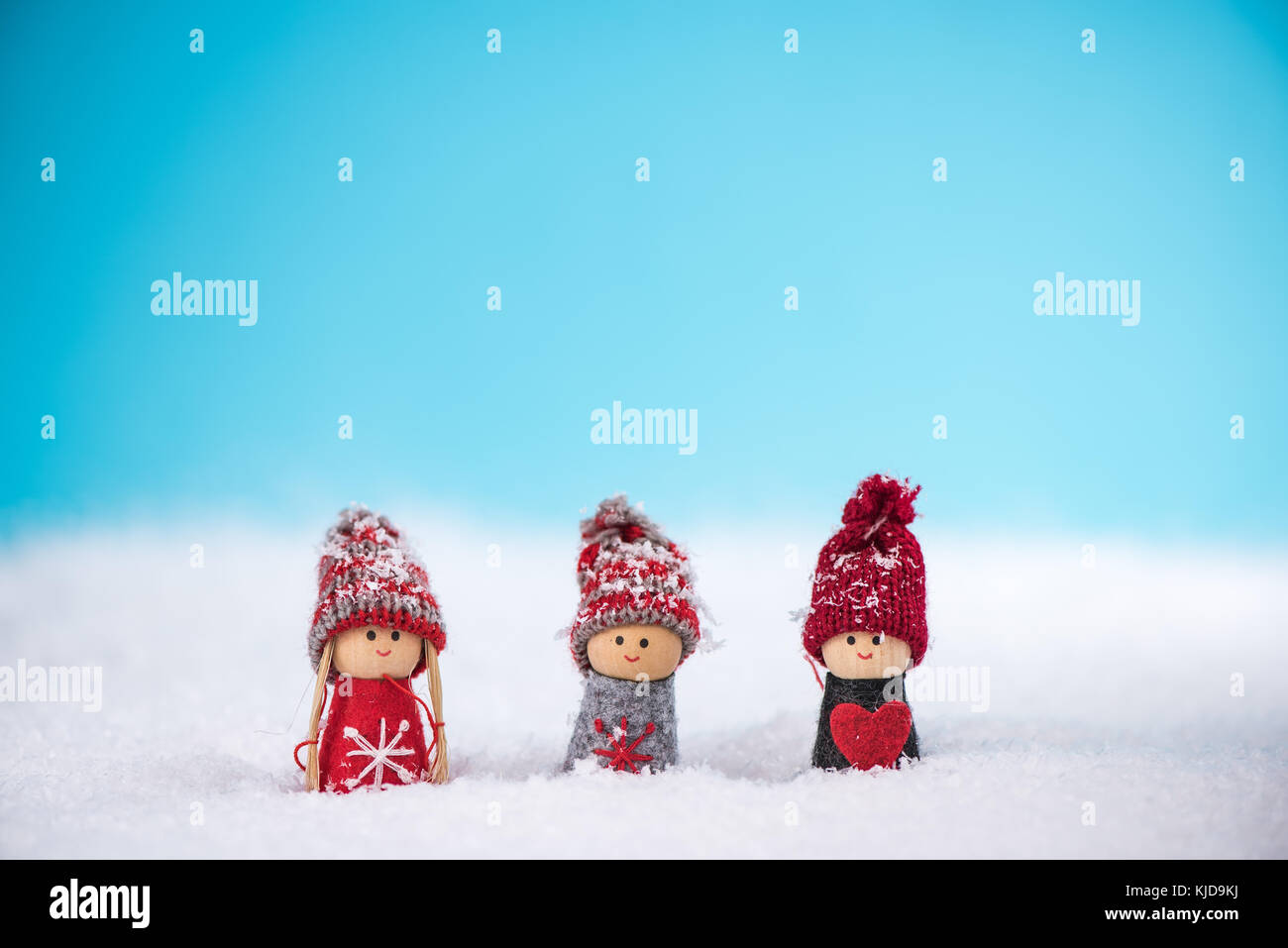 Happy kids enjoying snow together Stock Photo - Alamy