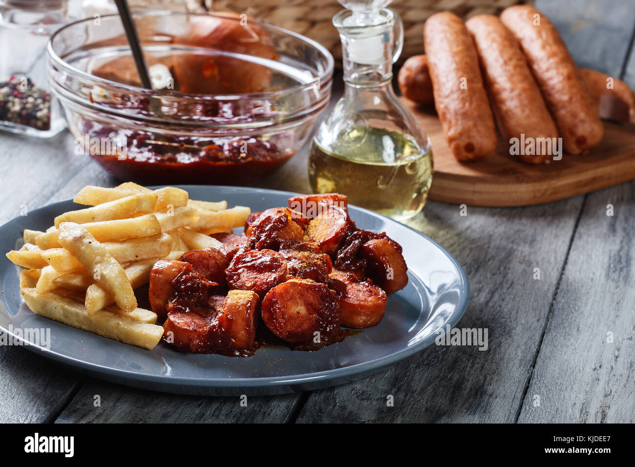 Traditional German currywurst pieces of sausage with curry sauce and