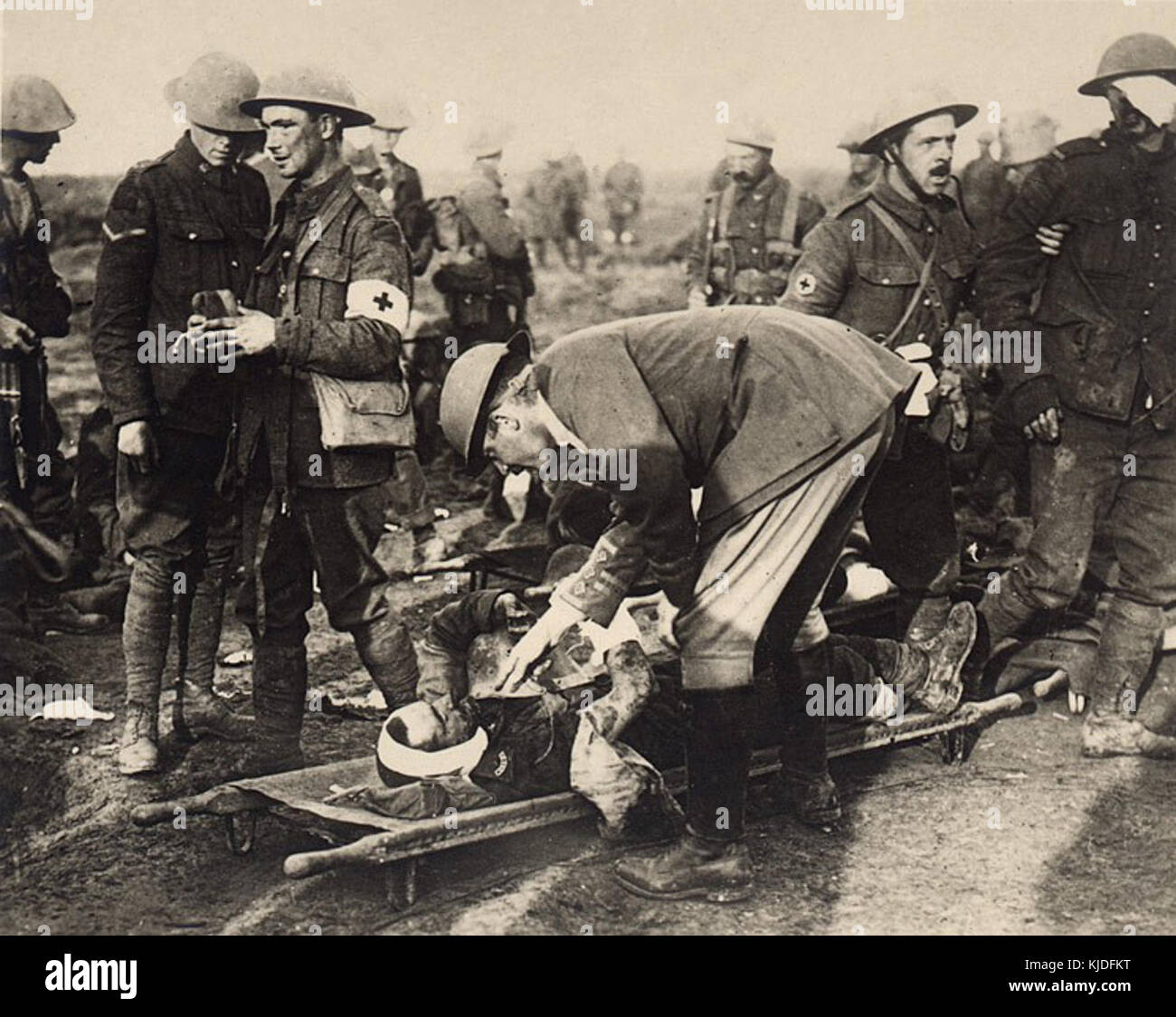 Wounded soldier clinging to a german helmet Stock Photo