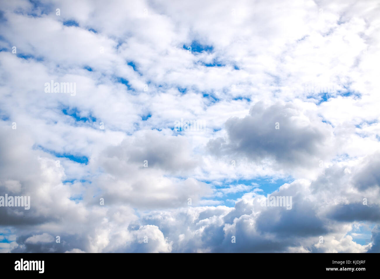 Blue sky covered in white and grey clouds on a cloudy day Stock Photo ...