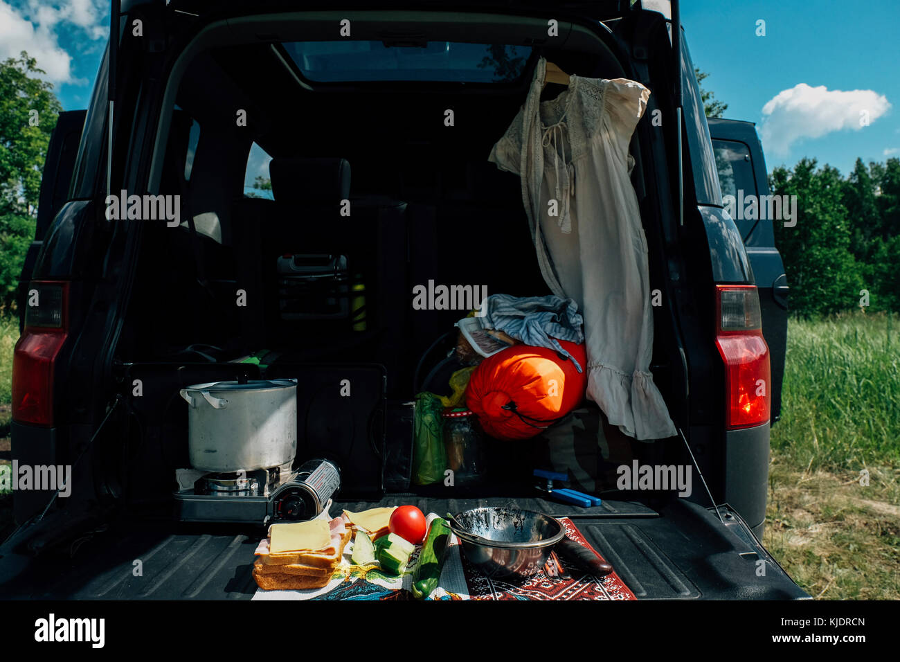 Food and camping gear in car Stock Photo