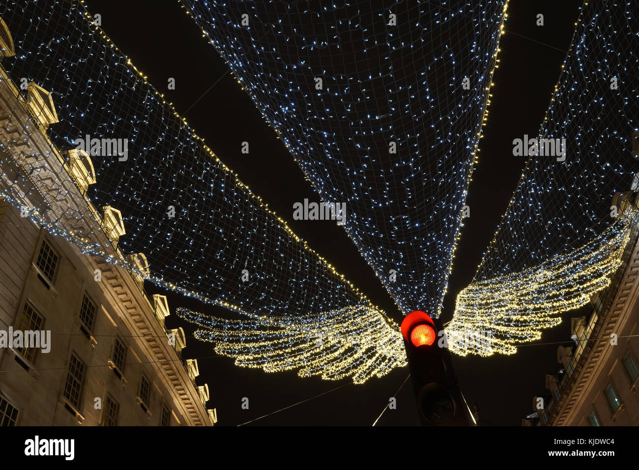 Christmas lights on Regent Street, London (angel partially eclipsed by traffic light) Stock Photo