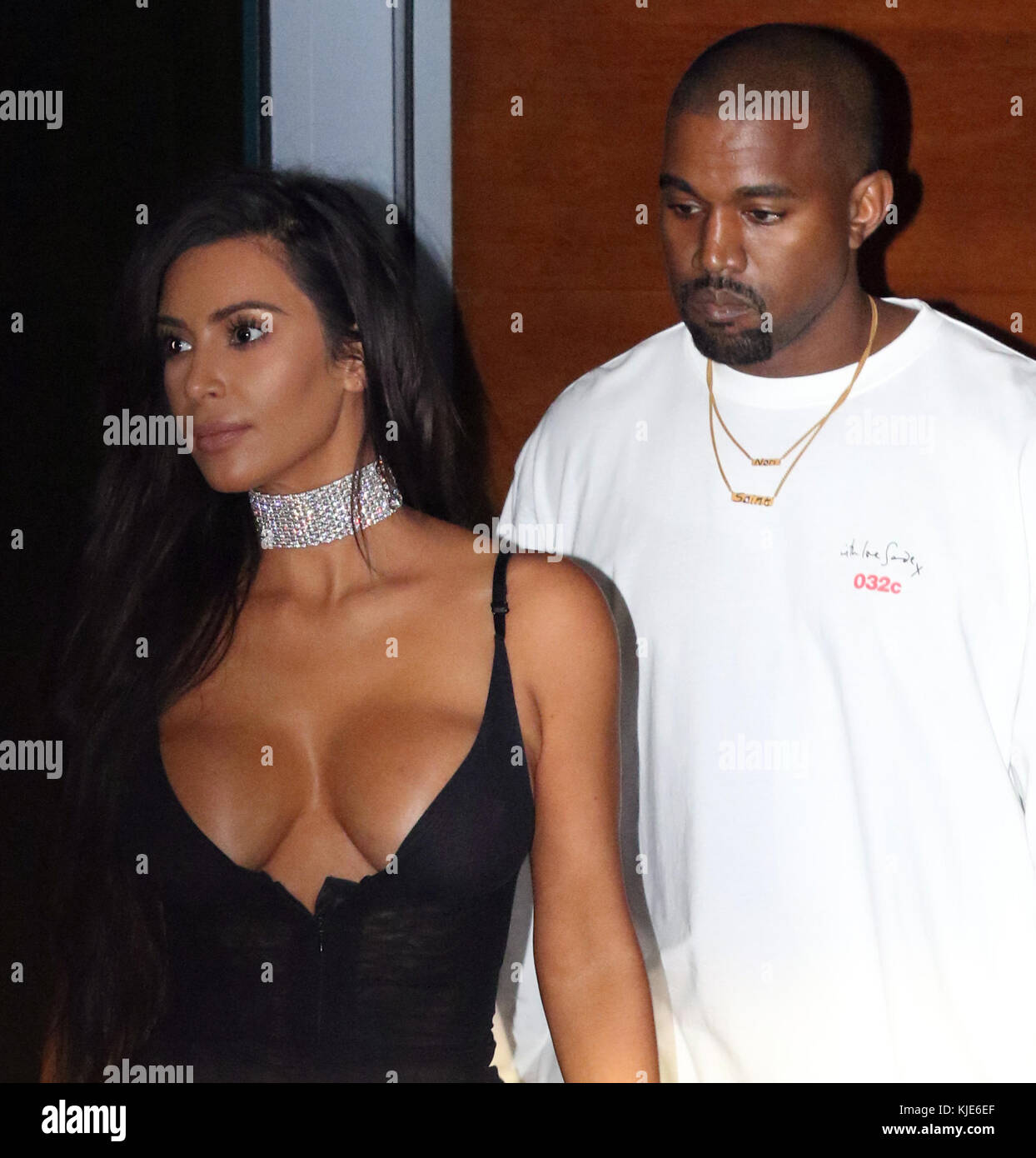 MIAMI BEACH, FL - SEPTEMBER 17: Kim Kardashian upstaged Kanye West on the  way to his Miami concert as she wore a low-cut, sheer black dress and  diamond choker that left little