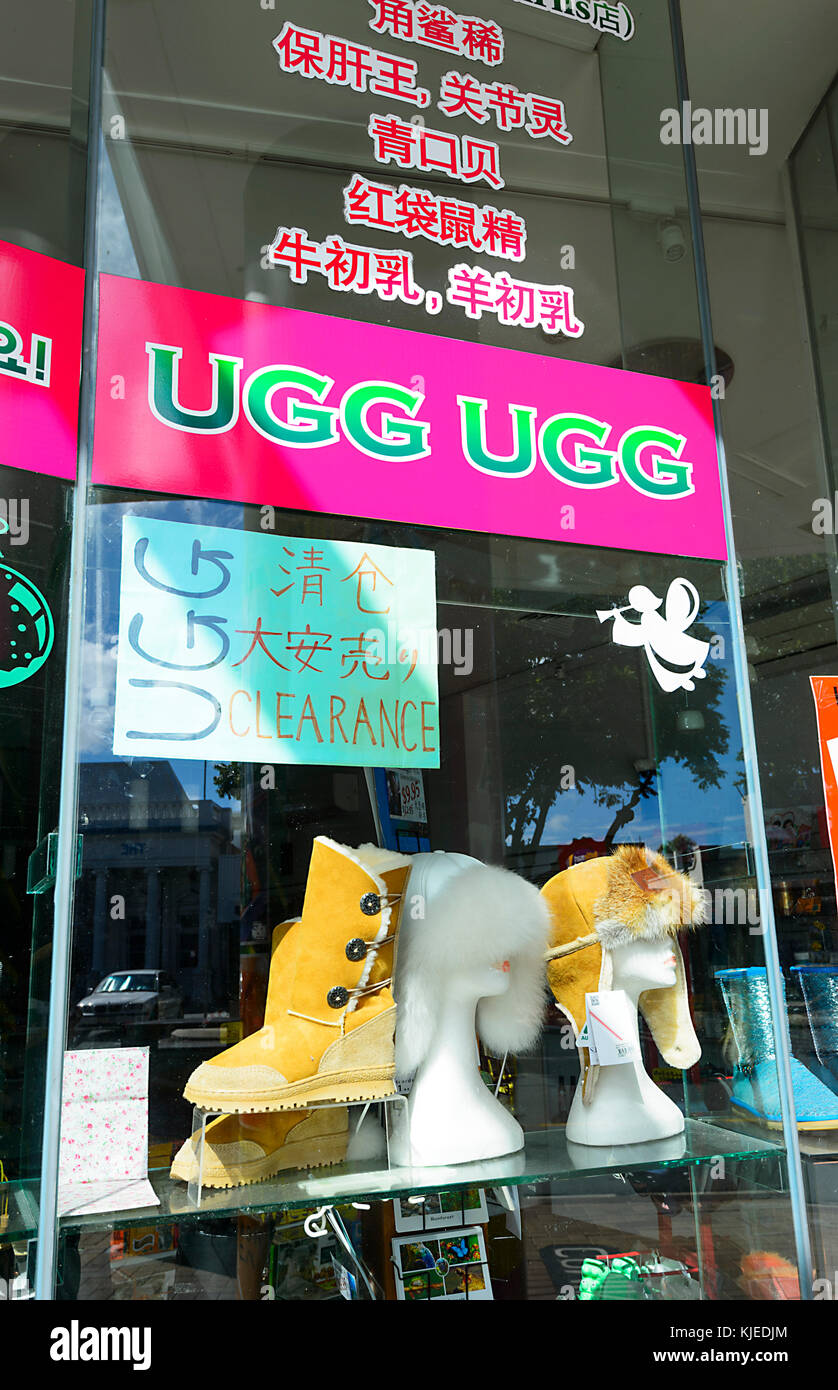 Window display of an Ugg Store with signs in Chinese, Cairns, Far North Queensland, FNQ, QLD, Australia Stock Photo