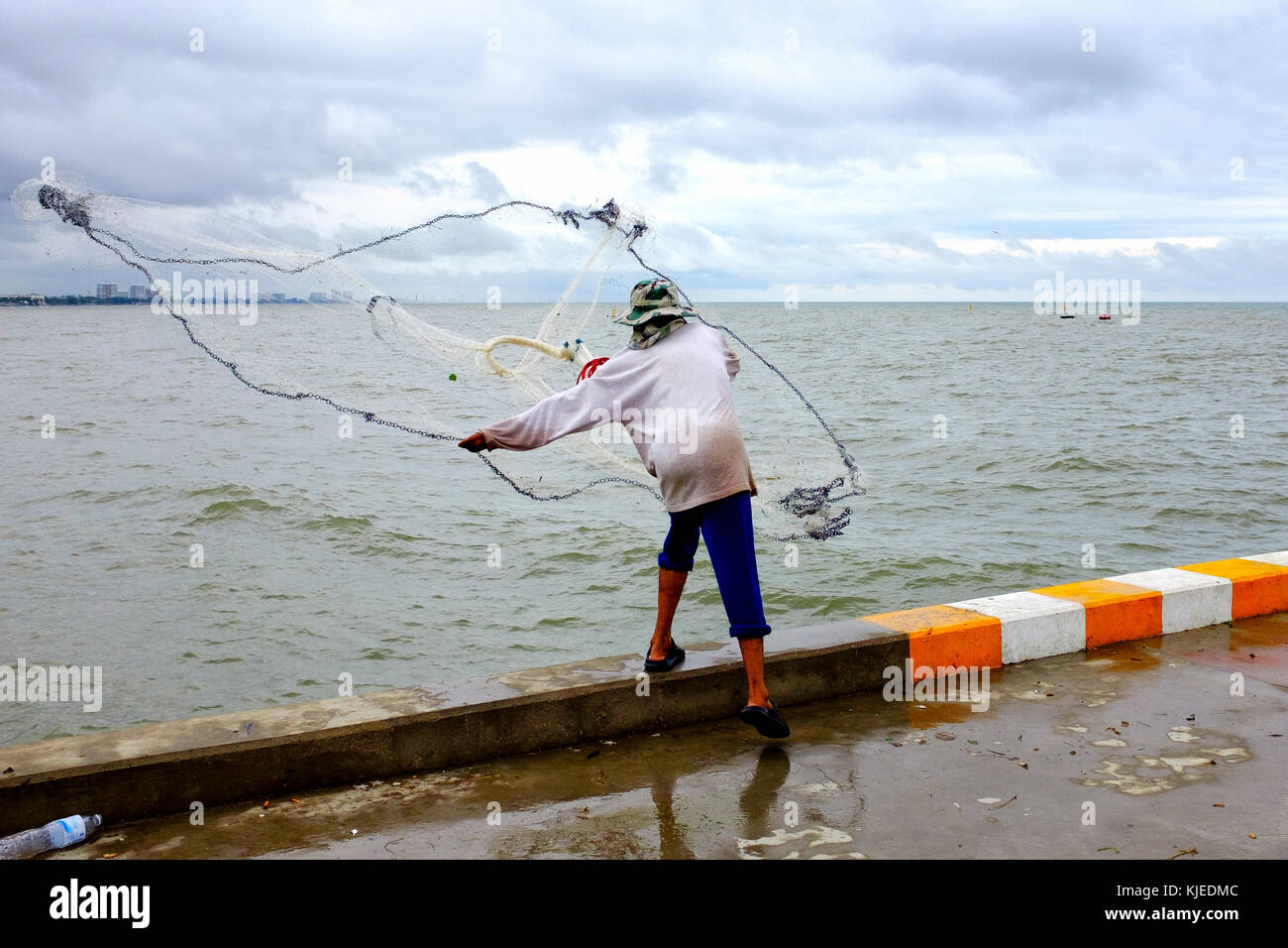 Fisherman in Saphan Pla, the fishing pier of Hua Hin, Thailand Stock Photo
