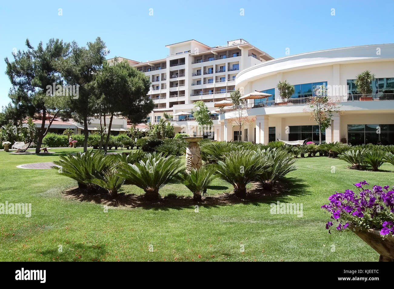 Belek, Turkey – June 01, 2015: View of the green lawn and moden building in the high class hotel Ela Quality Resort, Turkey. Stock Photo