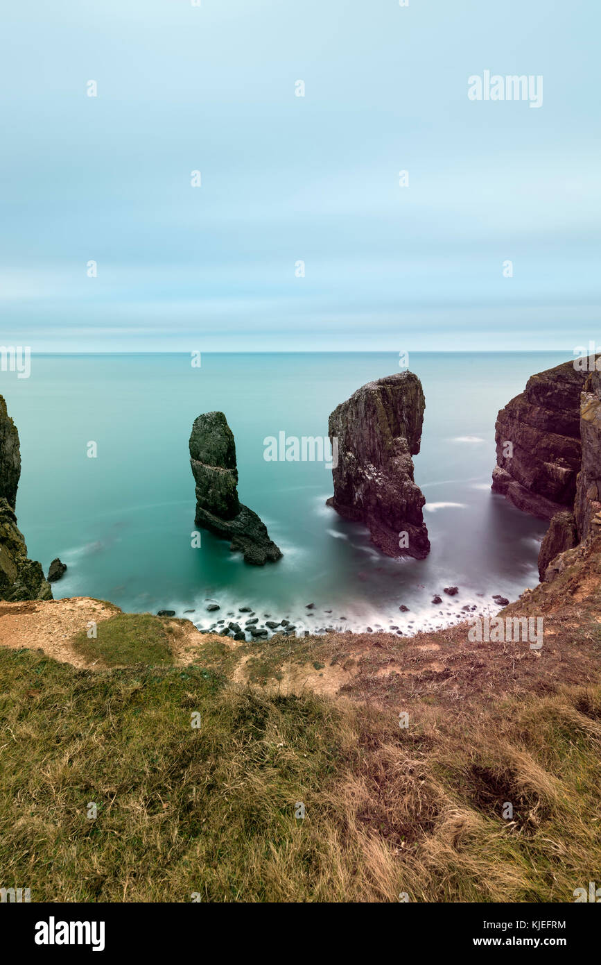 Beautiful long exposure landscape image of Elegug Stacks on Pembrokeshire Coast in Wales Stock Photo