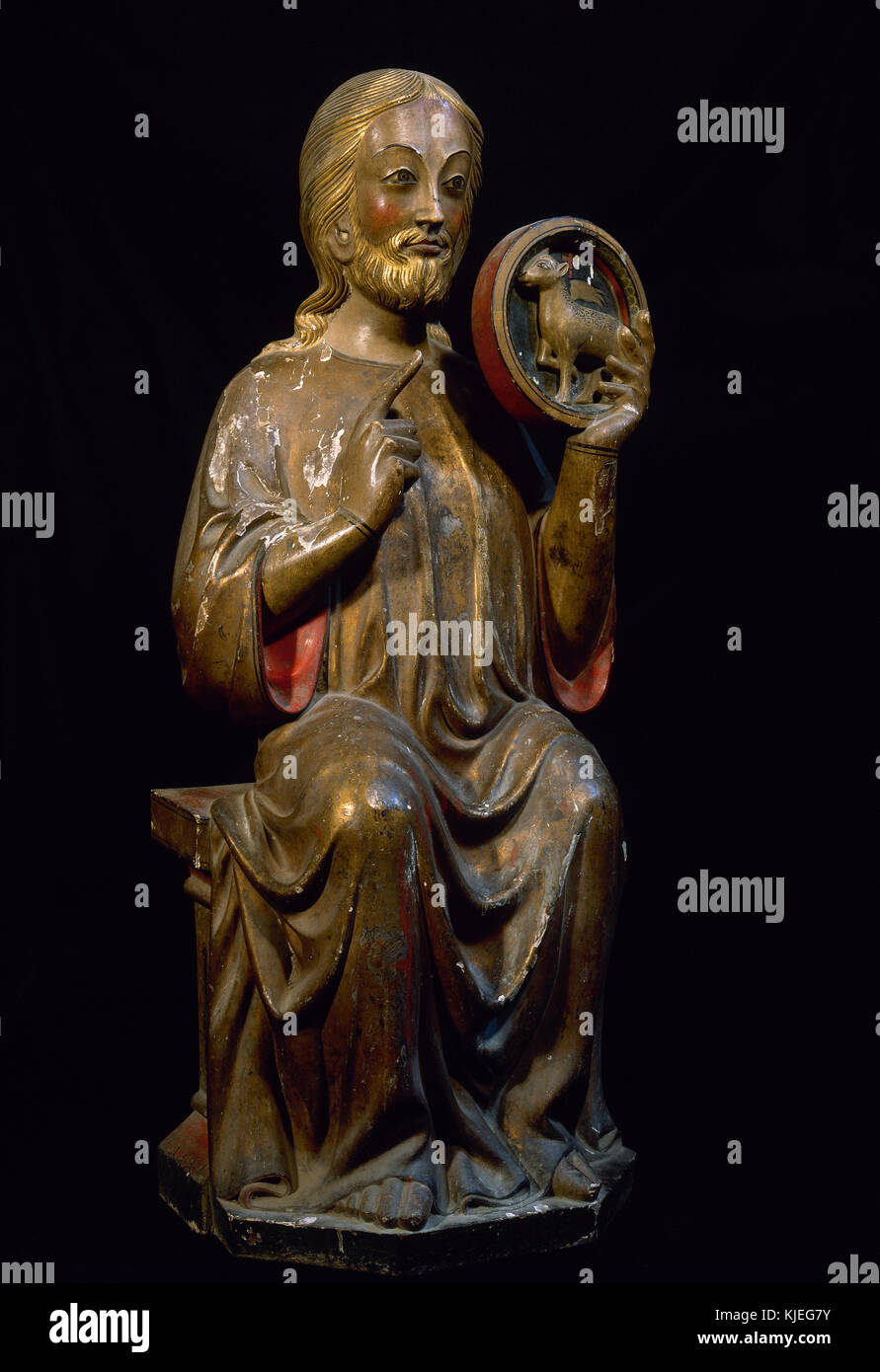 Saint John Baptist. Gothic statue. C. 1300. Possibly from Sant Joan d'Arties (Vall d'Aran, Catalonia). Coated with silver leaf and polychrome. Photo from 1989. Restored. Spain. Stock Photo