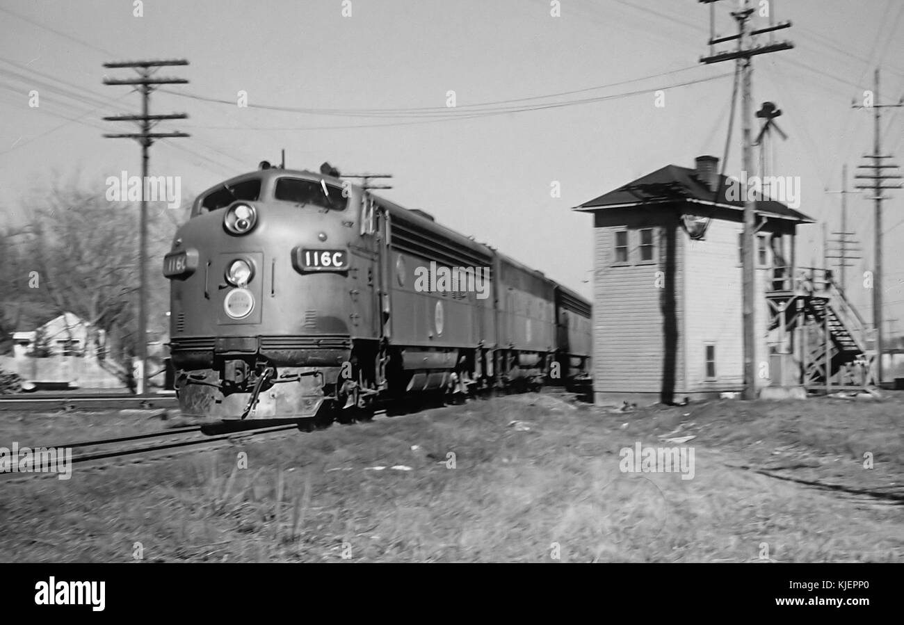 CGW 116 C (FP7A) westbound 2nd class  143 freight going over IC Crossing in Elmhirst, IL on April 20, 1962 (22415801926) Stock Photo