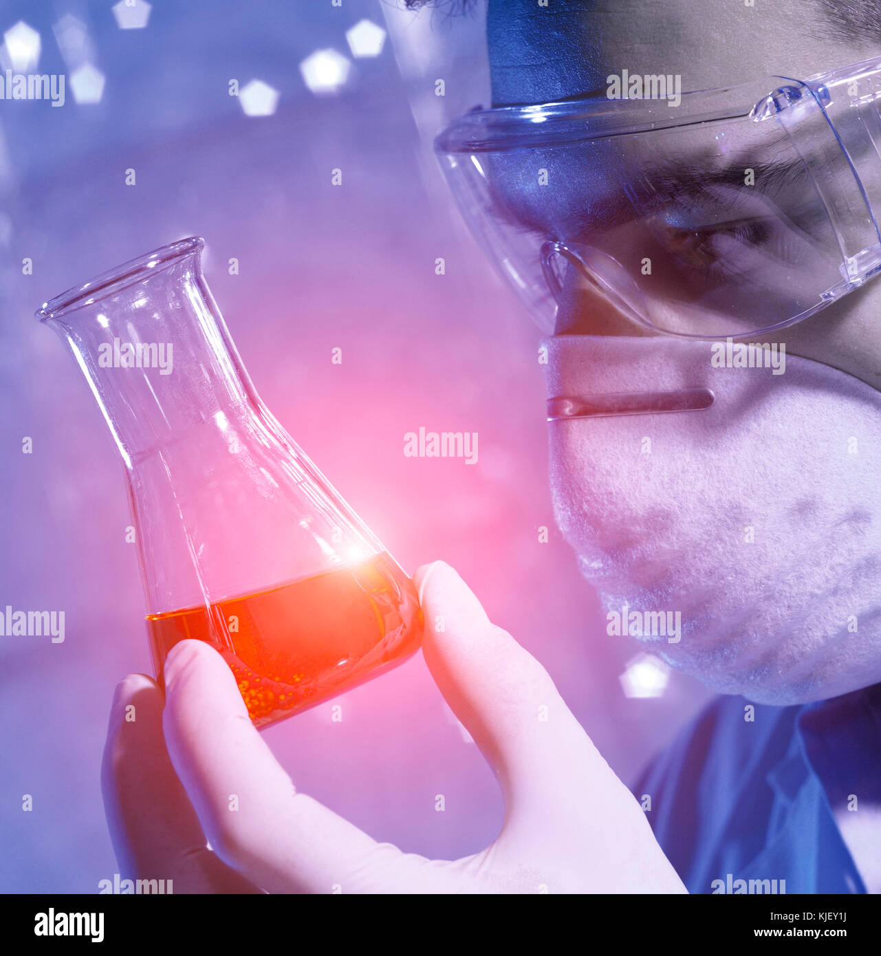 Caucasian scientist examining red liquid Stock Photo - Alamy