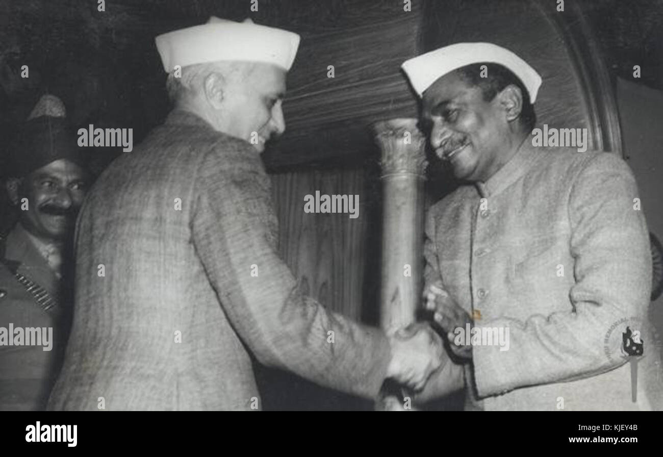 Dr. Rajendra Prasad shaking hands with Jawaharlal Nehru after signing the Constitution in 1950 Stock Photo