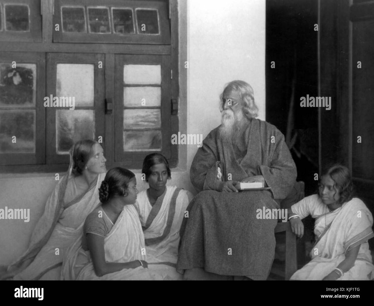 Rabindranath Tagore reading to others (1) Stock Photo