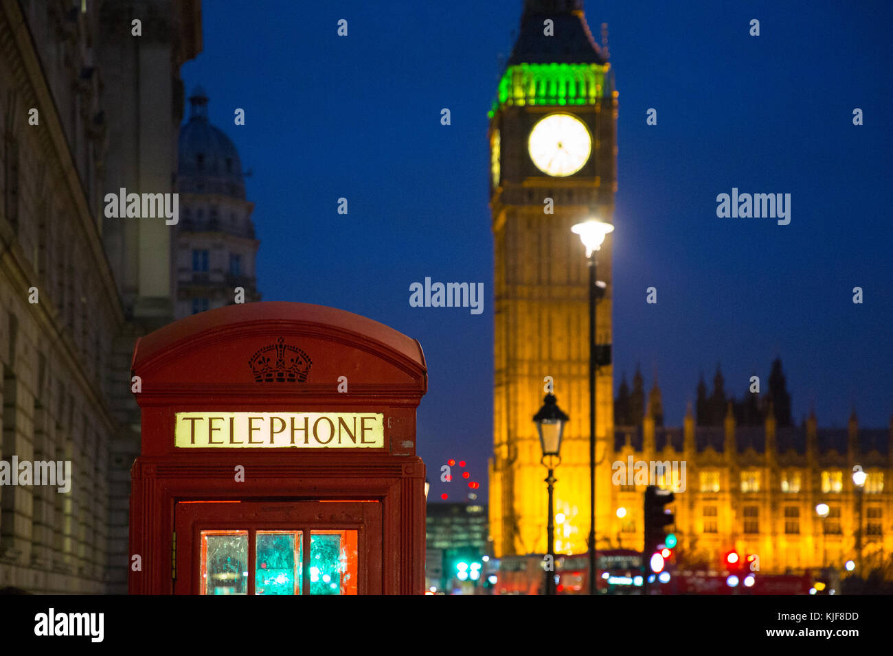 Red London telephone box with Big Ben at night London, UK Stock Photo