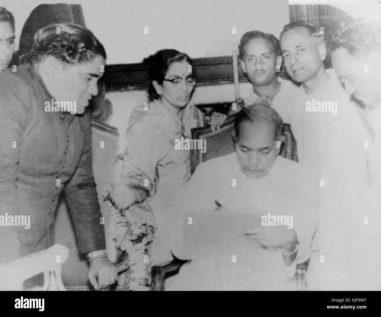 Dr. Babasaheb Ambedkar making corrections and Savita Ambedkar and ...